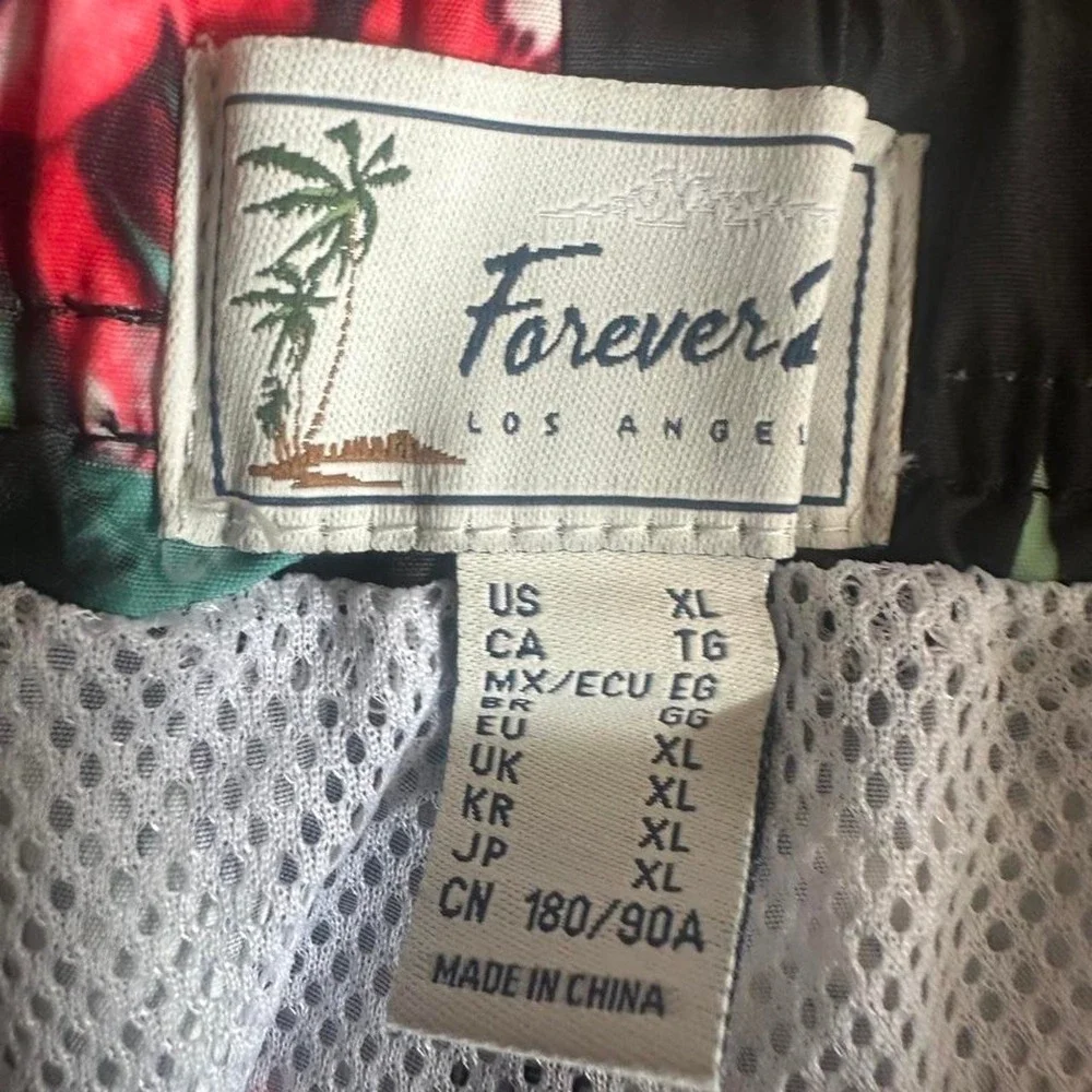Forever 21 red and green floral swim shorts with white trim, size XL